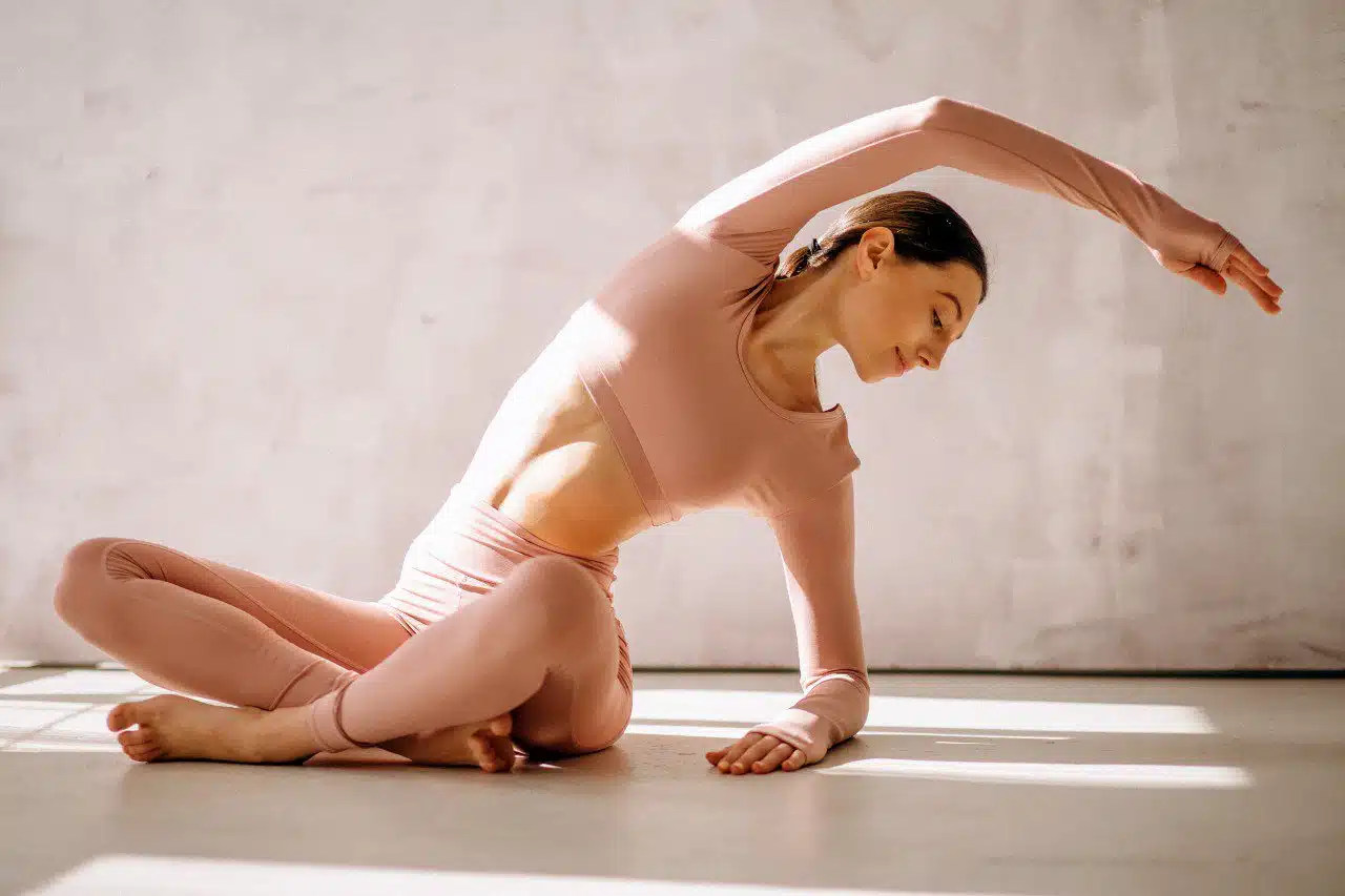 Three Tips For Avoiding Yoga Injuries-woman-stratching-isolated-02 3 Practical Tips For Avoiding Yoga Injuries